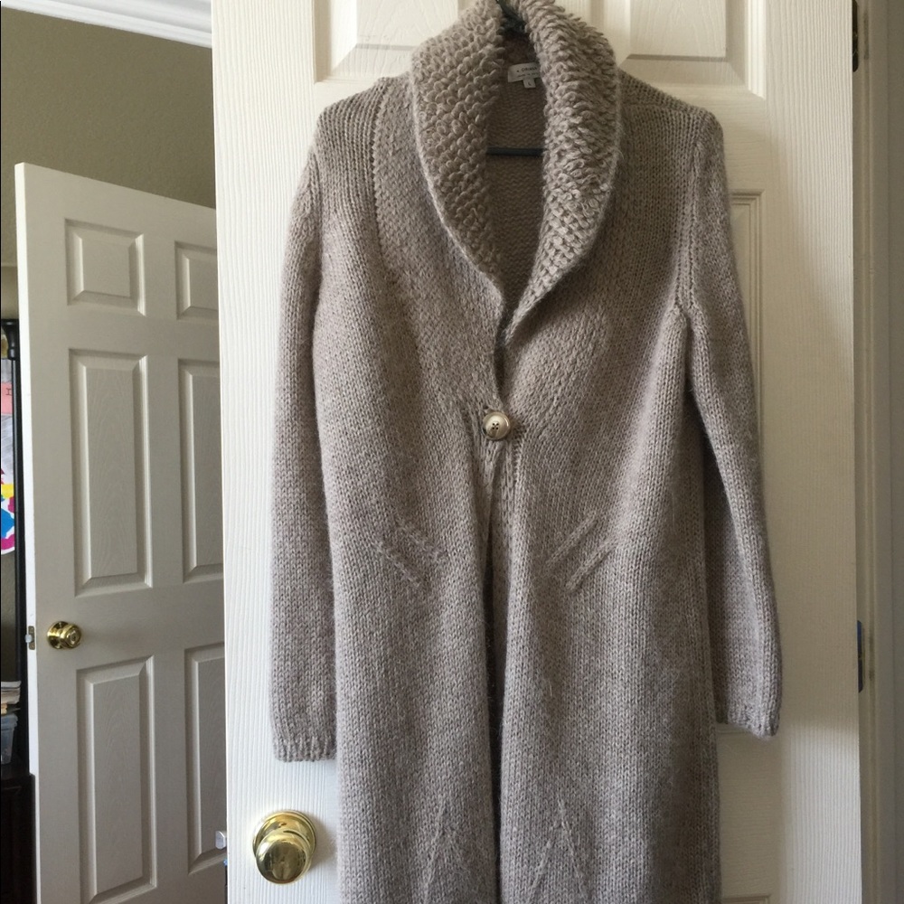 Long Cozy dust sweater in new condition.